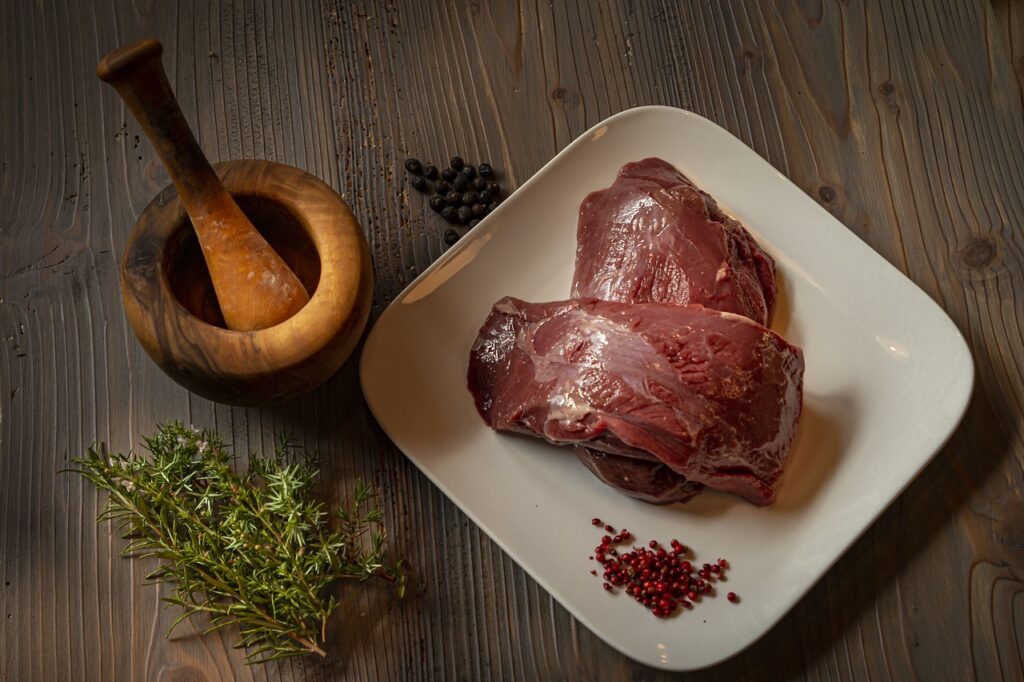 Raw venison on a plate