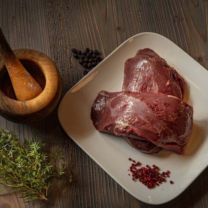 Raw venison on a plate