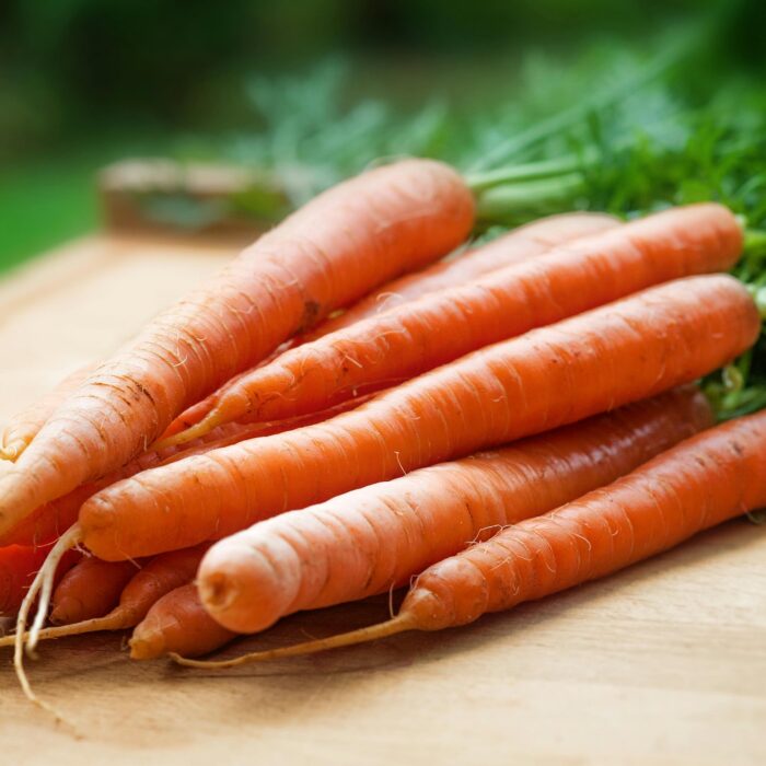 A bunch of Carrots on Table